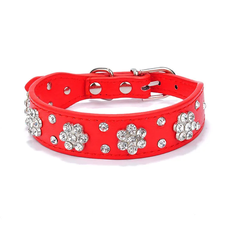 PU leather dog collar with rhinestone flower pattern and metal D-ring on a white background