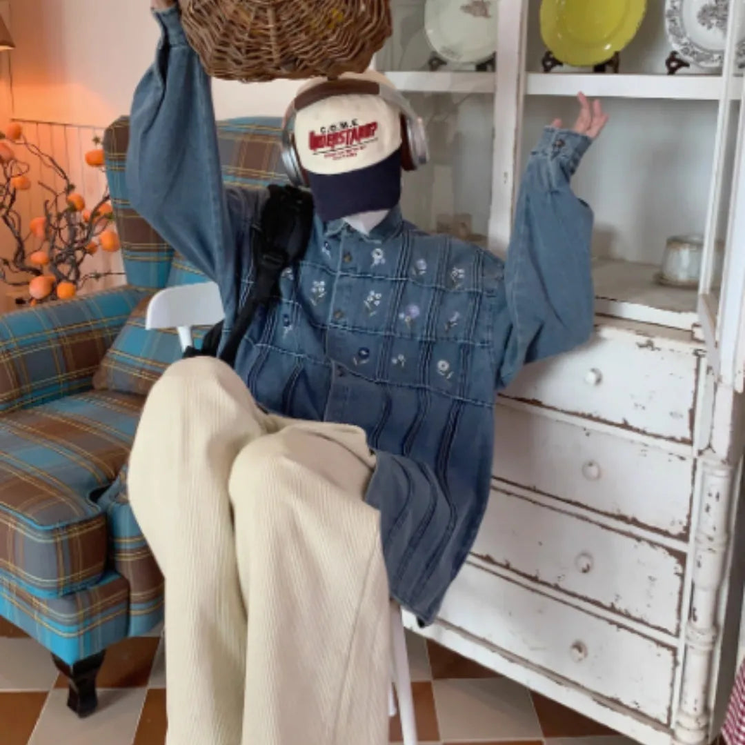 Vintage washed blue denim shirt with small floral embroidery and pleated front panel