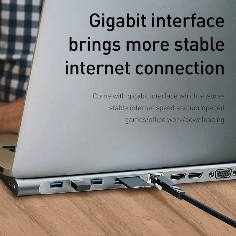 Gray aluminium USB C hub docking station with cooling bracket showing 10 ports including HDMI and Ethernet