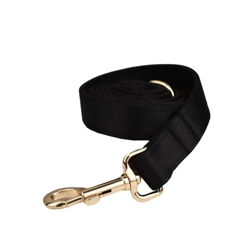 Complete dog accessory set showing collar, rope leash, decorative bow, and vest in coordinating colours