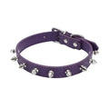 A spiked dog collar made of black PU leather with metal studs and an alloy buckle.