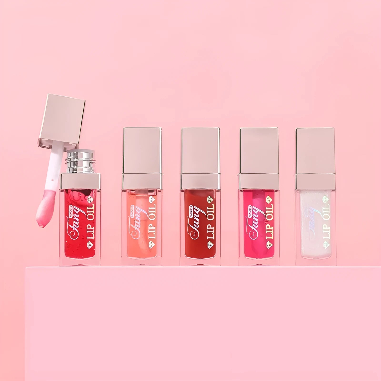 Five colourful tubes of mint-flavoured moisturising lip gloss with repairing formula
