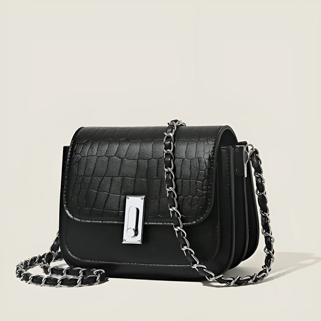 Women's black PU leather chain shoulder bag showing internal phone compartment and sewing thread detailing