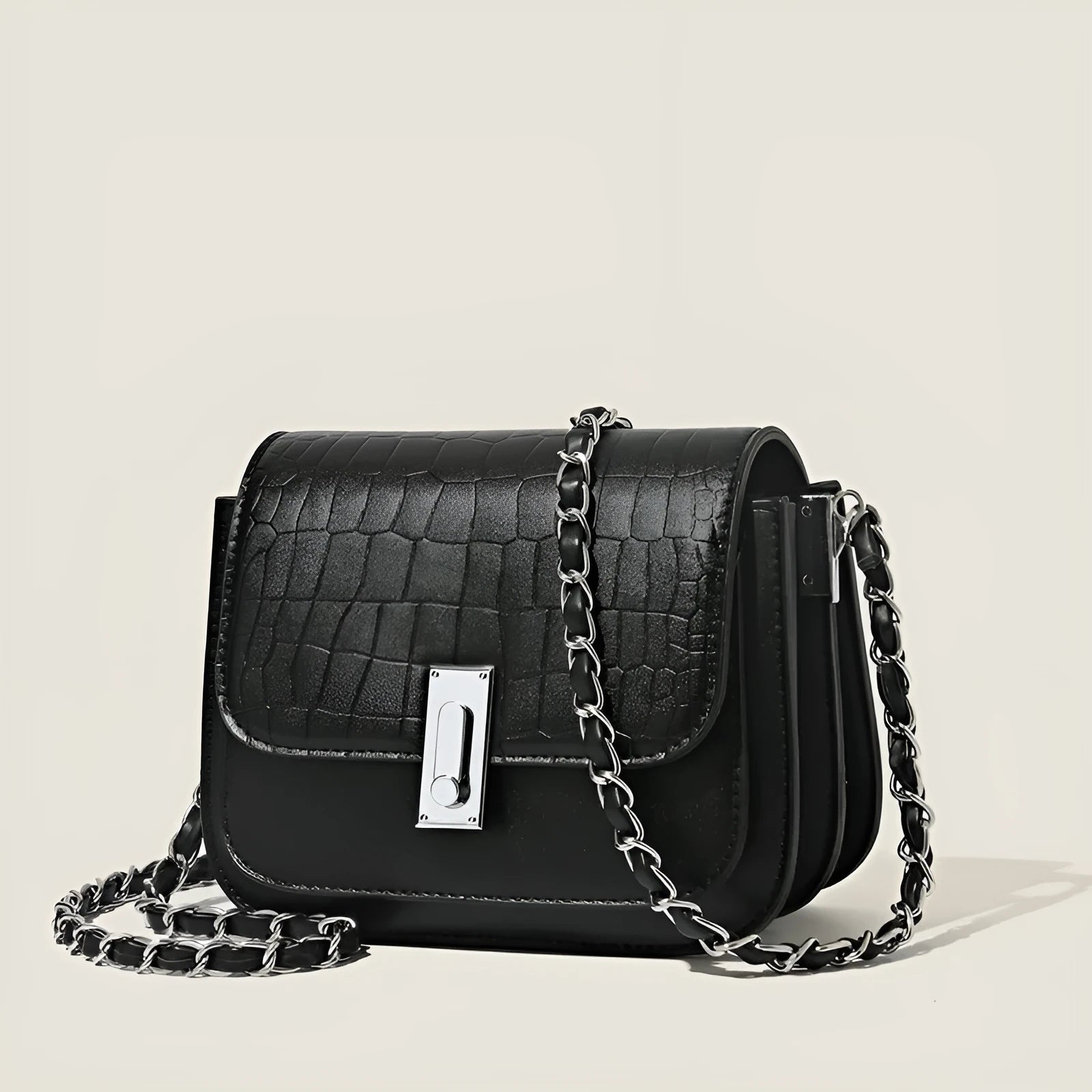 Women's black PU leather chain shoulder bag showing internal phone compartment and sewing thread detailing