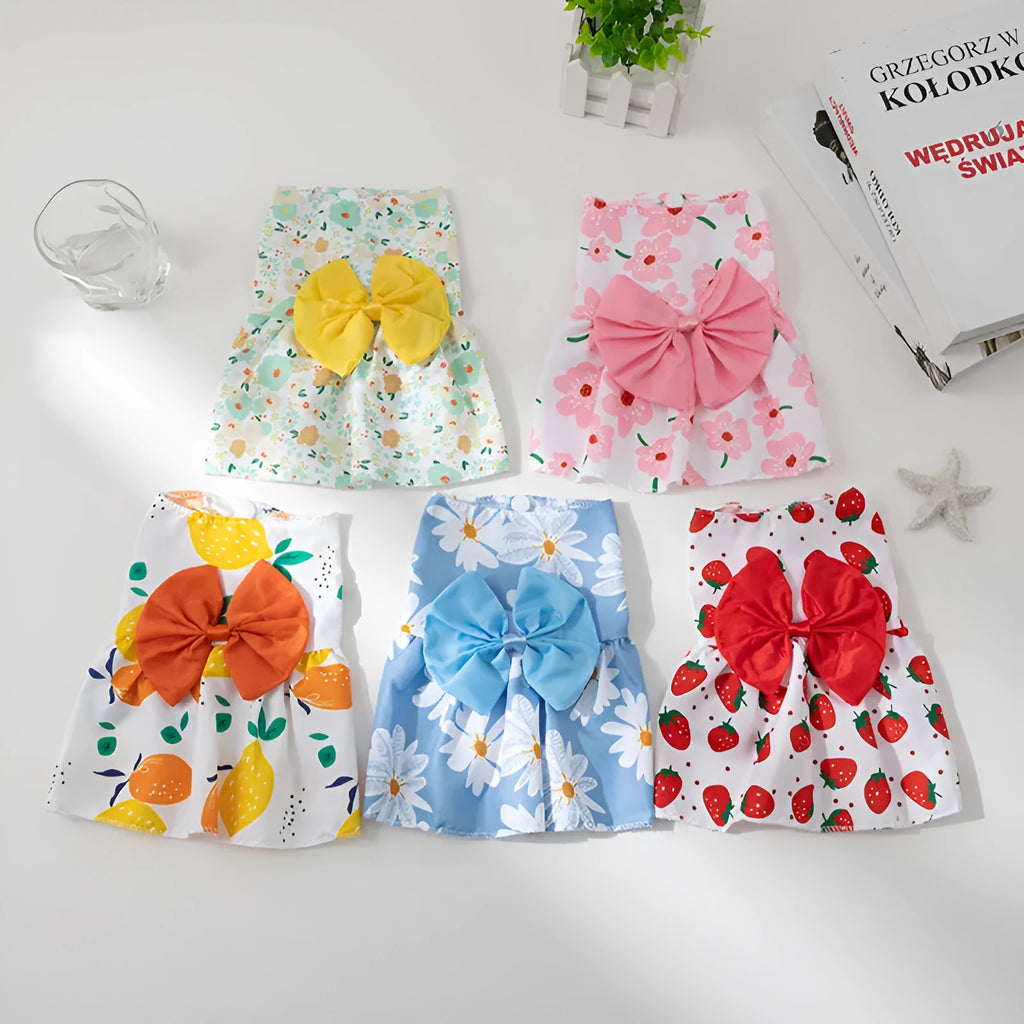 Ultra-thin floral butterfly knot pet dress for dog or cat with coloured bow, shown in blue.