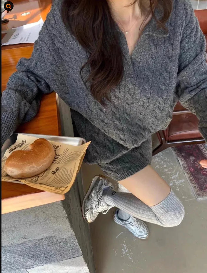Women's creamy-white cable knit sweater and shorts set with an elastic waistband.