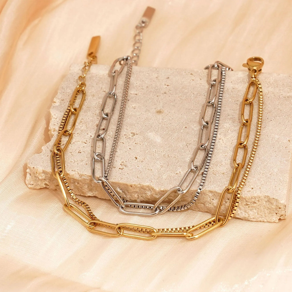 Double-layer titanium steel women's bracelet with geometric shape and linear design elements in gold or silver finish