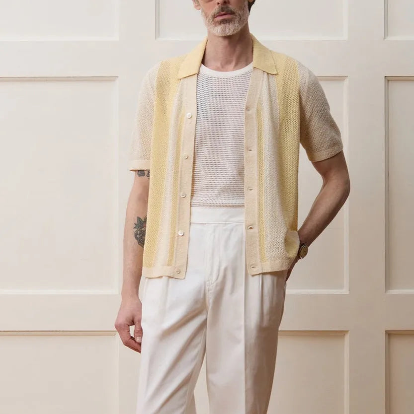 Yellow men's polo shirt with hollow-out knit design and asymmetric details in Tencel fabric