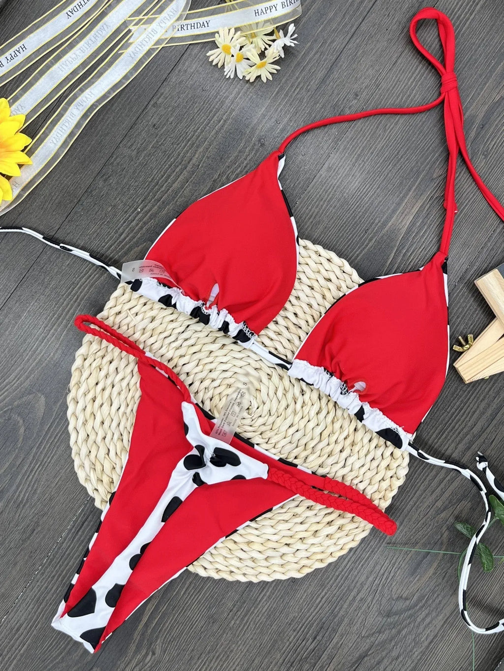 Backless one-piece swimsuit with heart print and split design in quick-dry nylon fabric.