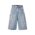 Distressed raw edge denim shorts in light blue, straight leg cropped cut.