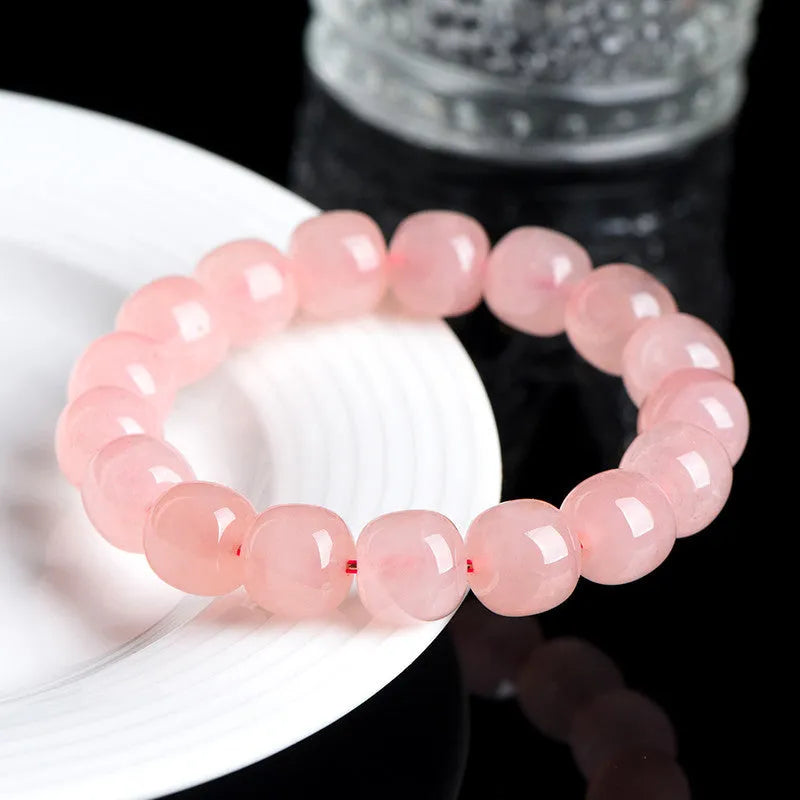 Natural pink crystal barrel bead bracelet with geometric 8x10mm beads