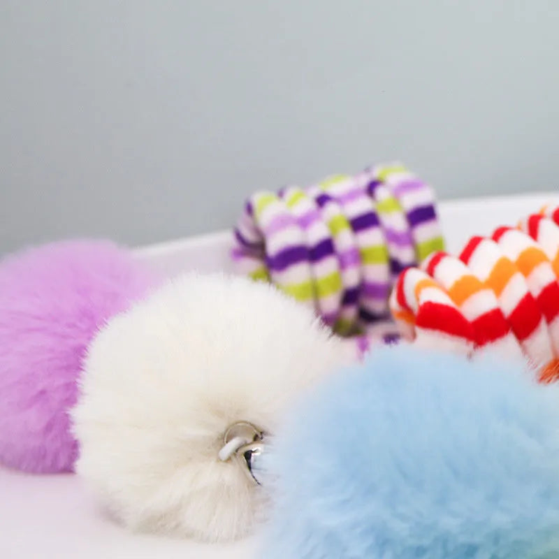 Hanging cat toy with inflatable ball on spring stick and suction cup base for kittens