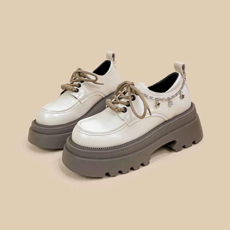 White platform leather Mary Jane shoes with round toe, lace-up front, and a thick 6-8cm chunky heel.
