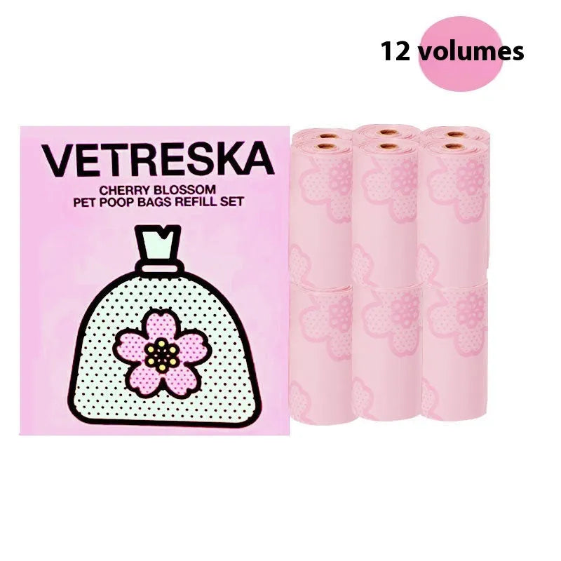 Dog poo bag dispenser capsule with strawberry pattern and roll of 15 biodegradable scented bags