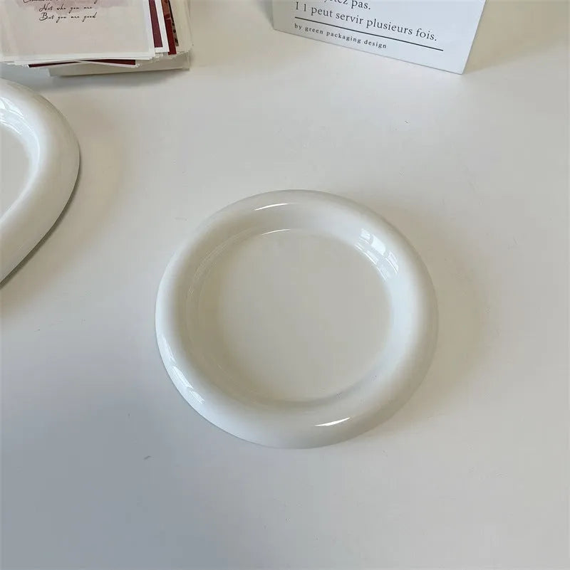 White ceramic plate with bear doodle design, 20cm diameter, on a table.