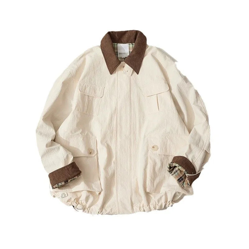 Green and apricot unisex casual jacket with contrast colour blocks and side seam pockets.