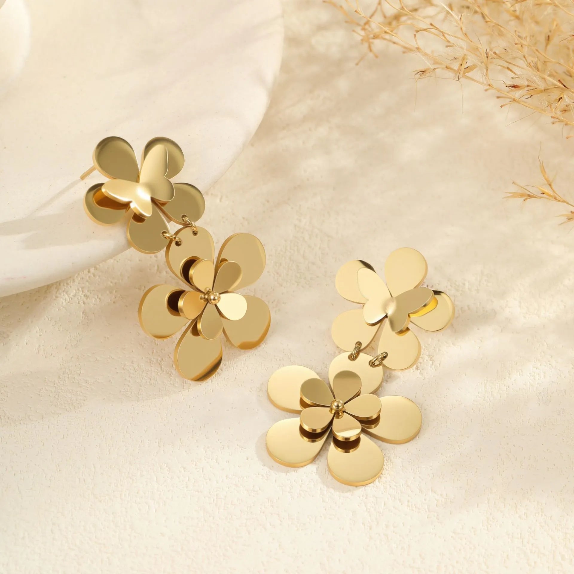 Gold plated stainless steel earrings featuring flower and butterfly geometric design for women
