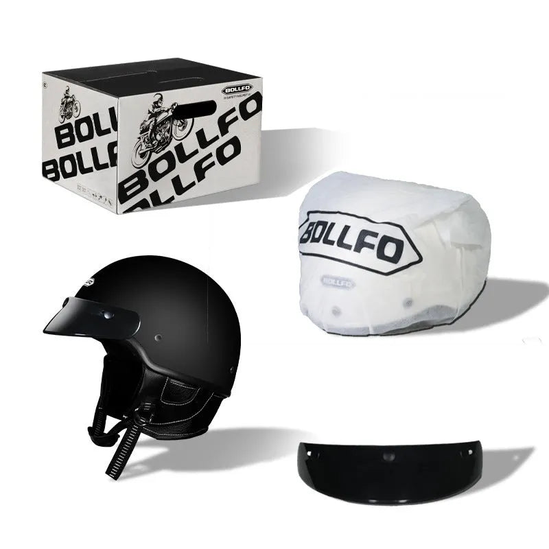 Retro style motorcycle helmet in matte black on a stand, showing classic biker design.
