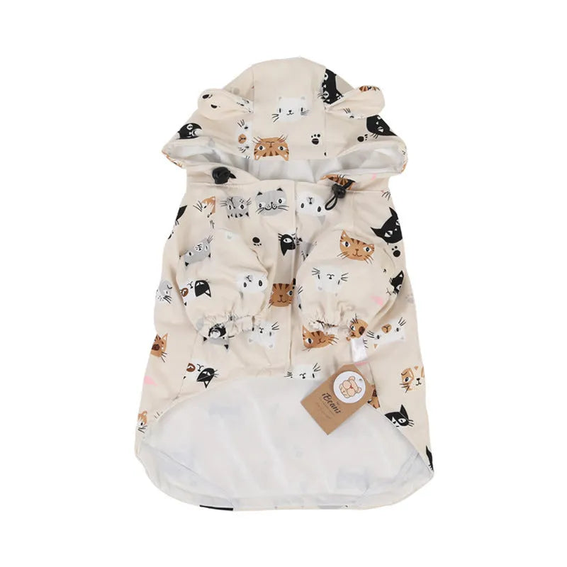 Beige dog raincoat with cartoon cat head pattern, showing waterproof PU material