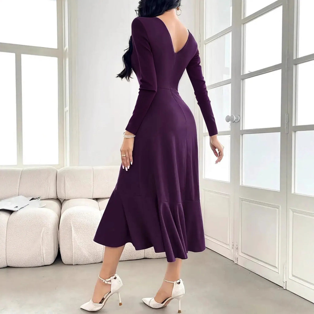 Purple women's long sleeve dress with ruffles and a round neck, shown on a mid-waist silhouette.