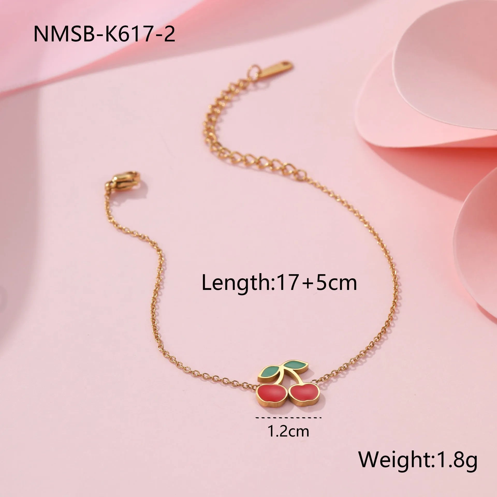 Four-piece cherry jewellery set with necklace, bracelet, earrings and ring in stainless steel with gold-toned finish
