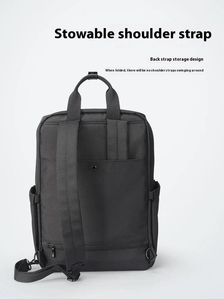 Black Oxford cloth computer backpack showing main compartment and 20-35L capacity.