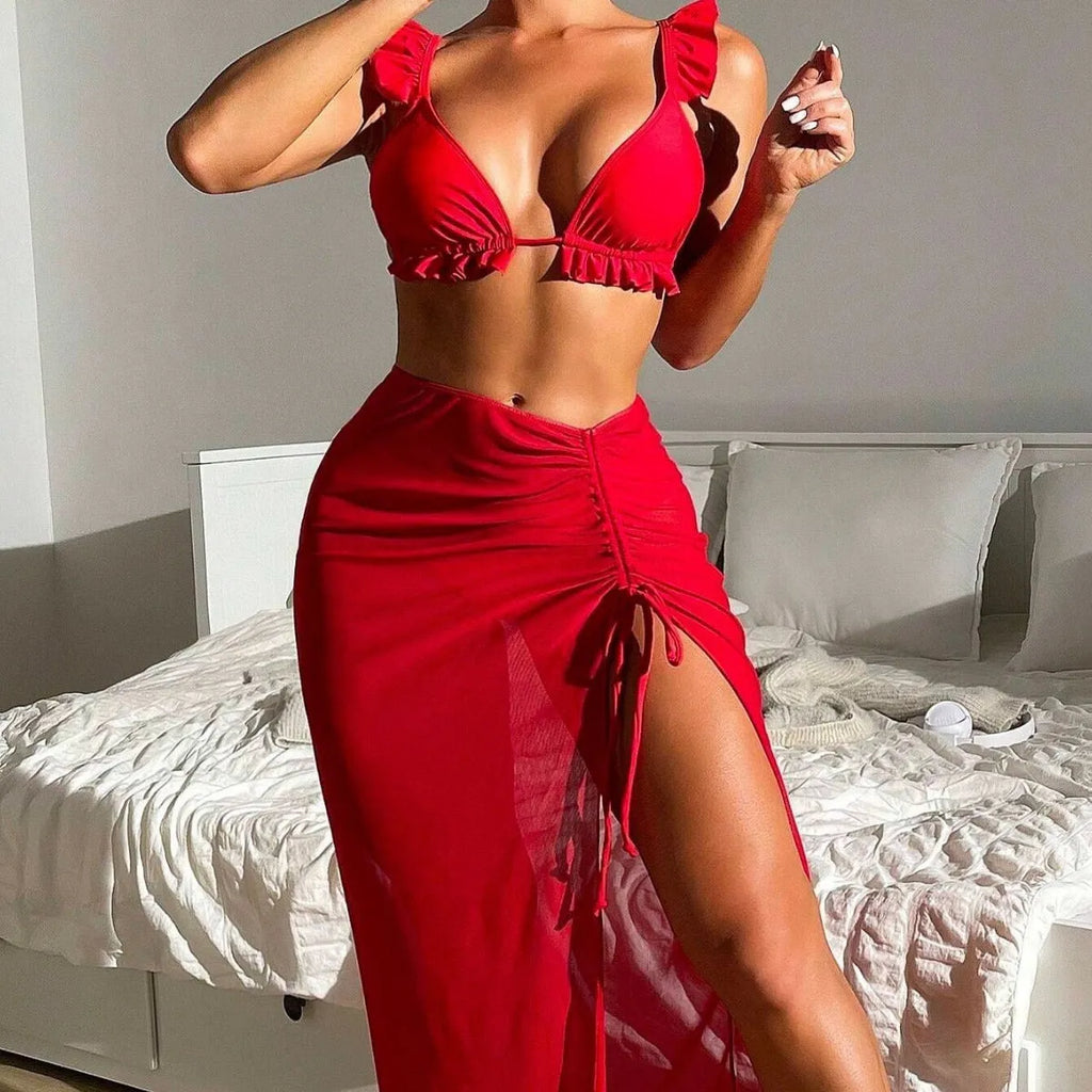 Women's printed three-piece swimsuit set consisting of a bikini top, bottoms, and a matching swim skirt.