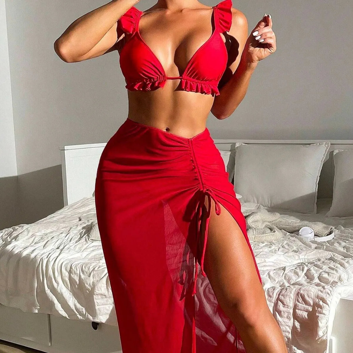 Women's printed three-piece swimsuit set consisting of a bikini top, bottoms, and a matching swim skirt.