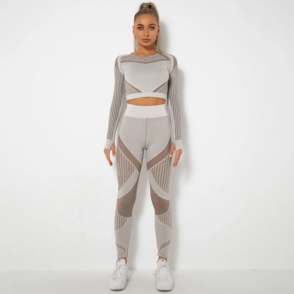Women's long-sleeved seamless knitted yoga suit in a stripe pattern, shown in navy blue.