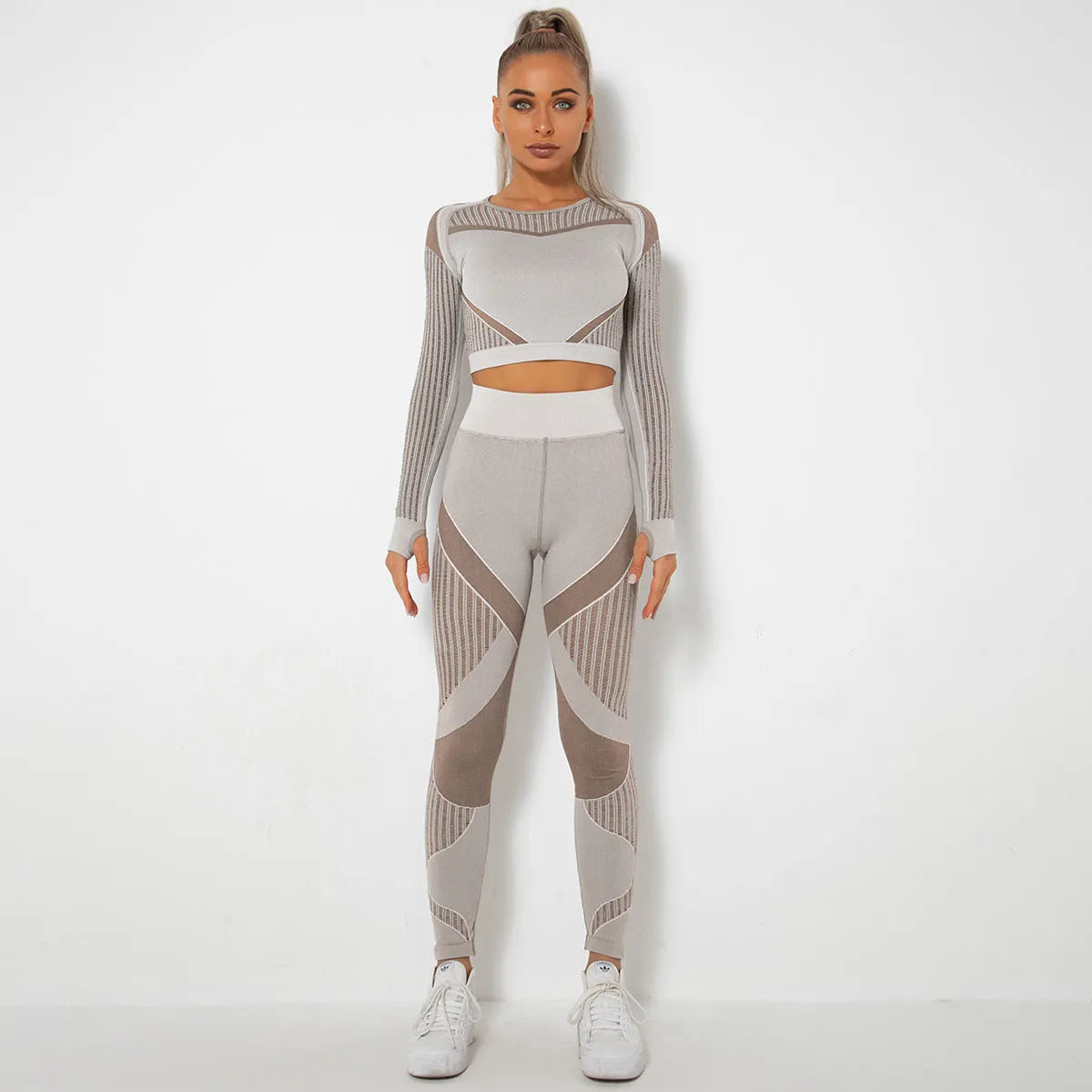 Women's long-sleeved seamless knitted yoga suit in a stripe pattern, shown in navy blue.