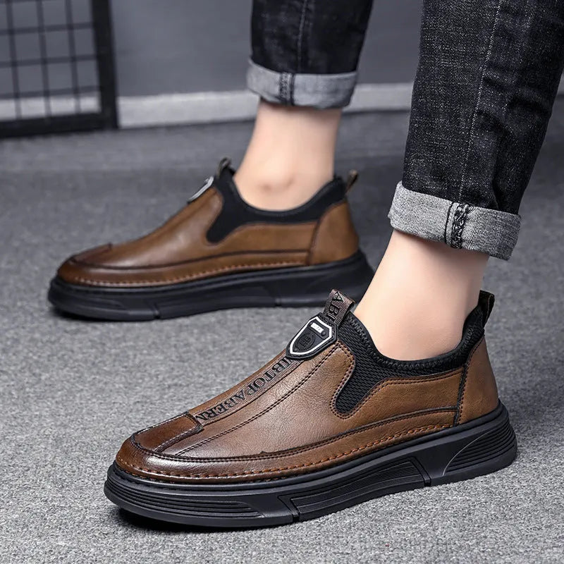 Men's solid colour casual leather shoes with round toe in black and brown options.