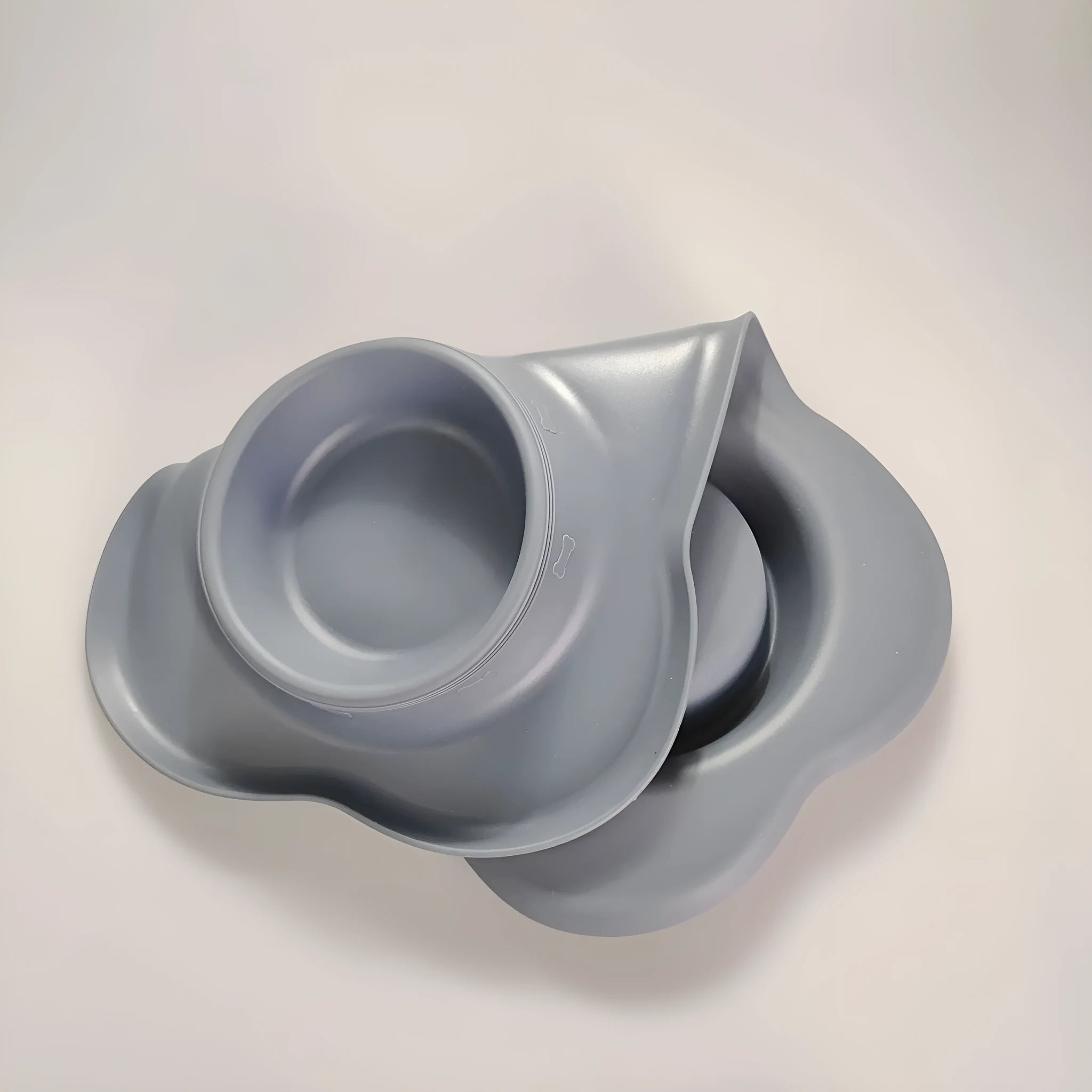 Large silicone dog bowl with stainless steel dish in blue colour on non-slip mat