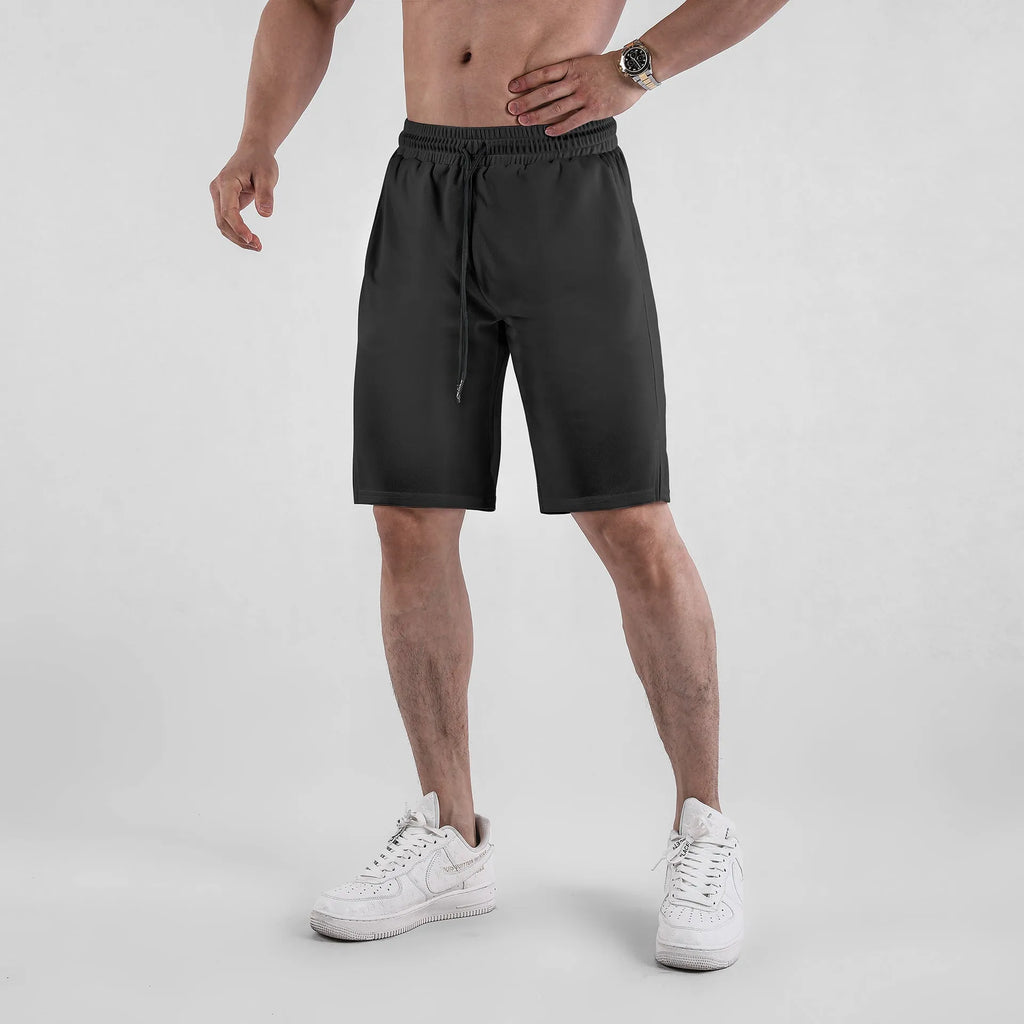 Men's quick-drying mesh shorts in black with elastic waistband and loose fit design