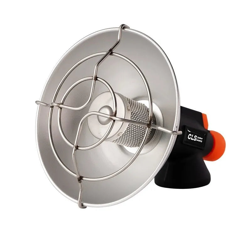 Black and orange mini portable outdoor heating stove with automatic ignition on a table.