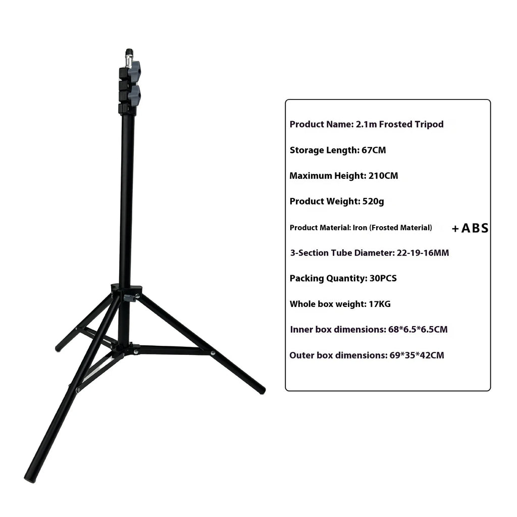 A frosted finish floor tripod light stand at full height with a mobile phone holder attached.