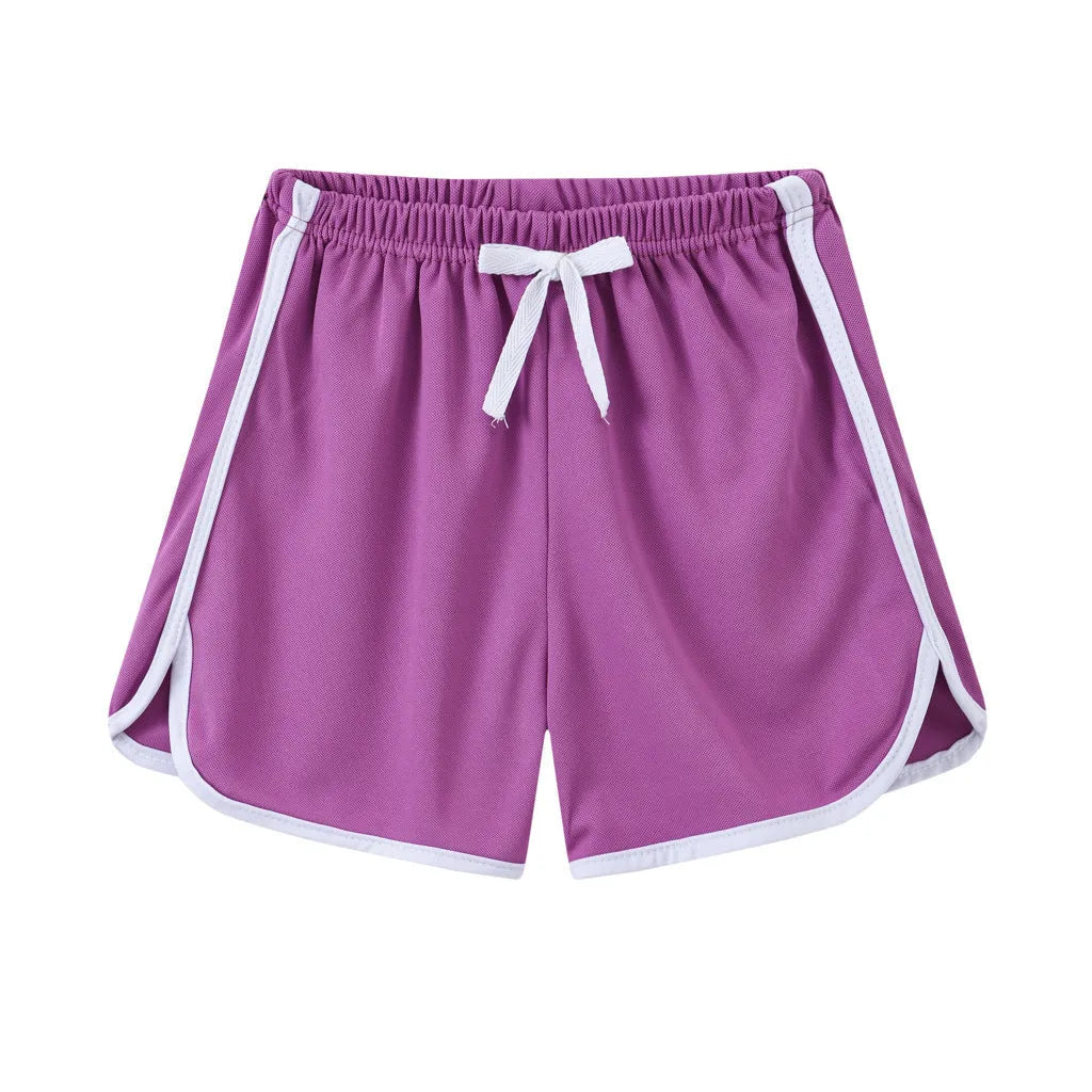 Children's polyester beach shorts in various colors and patterns including pineapple and kitten designs for sizes 100 to 140