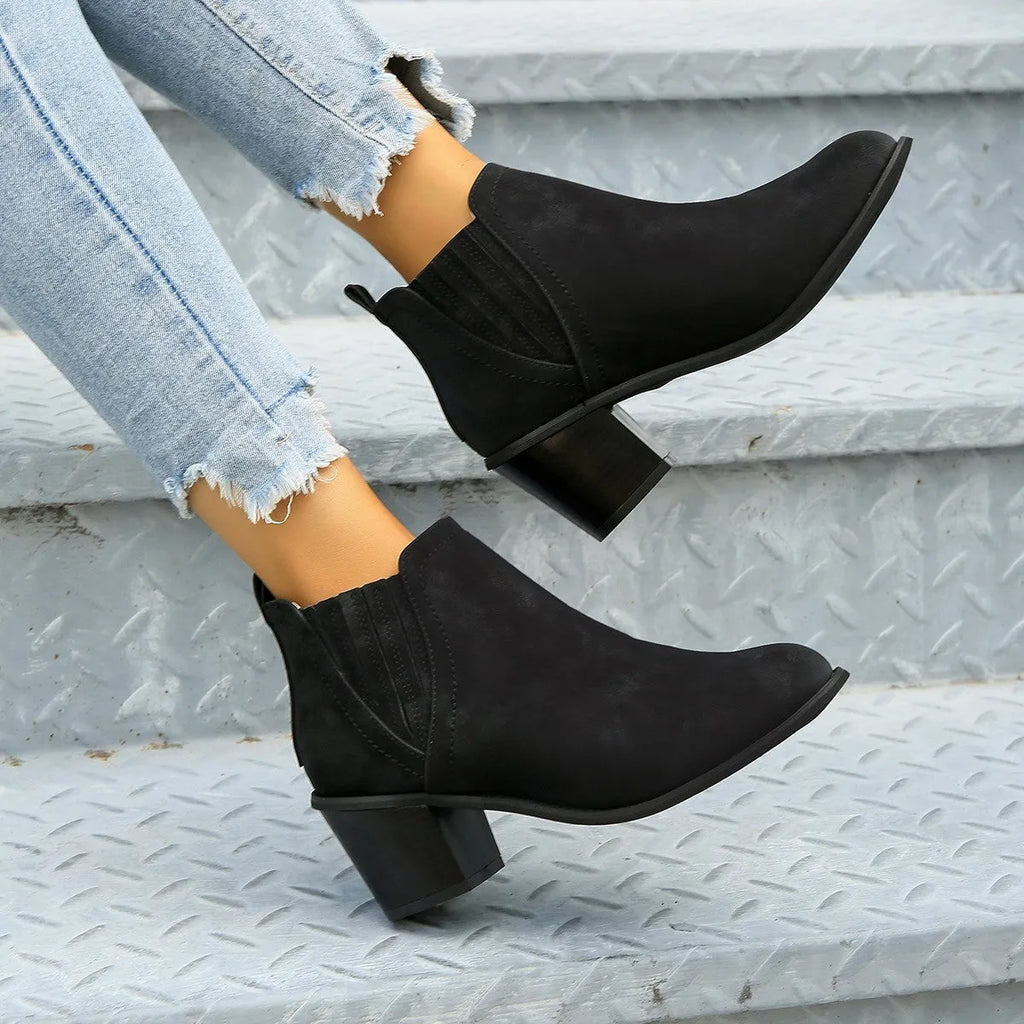 Women's black ankle boots with pointed toe and thick square heel, slip-on design for autumn winter wear