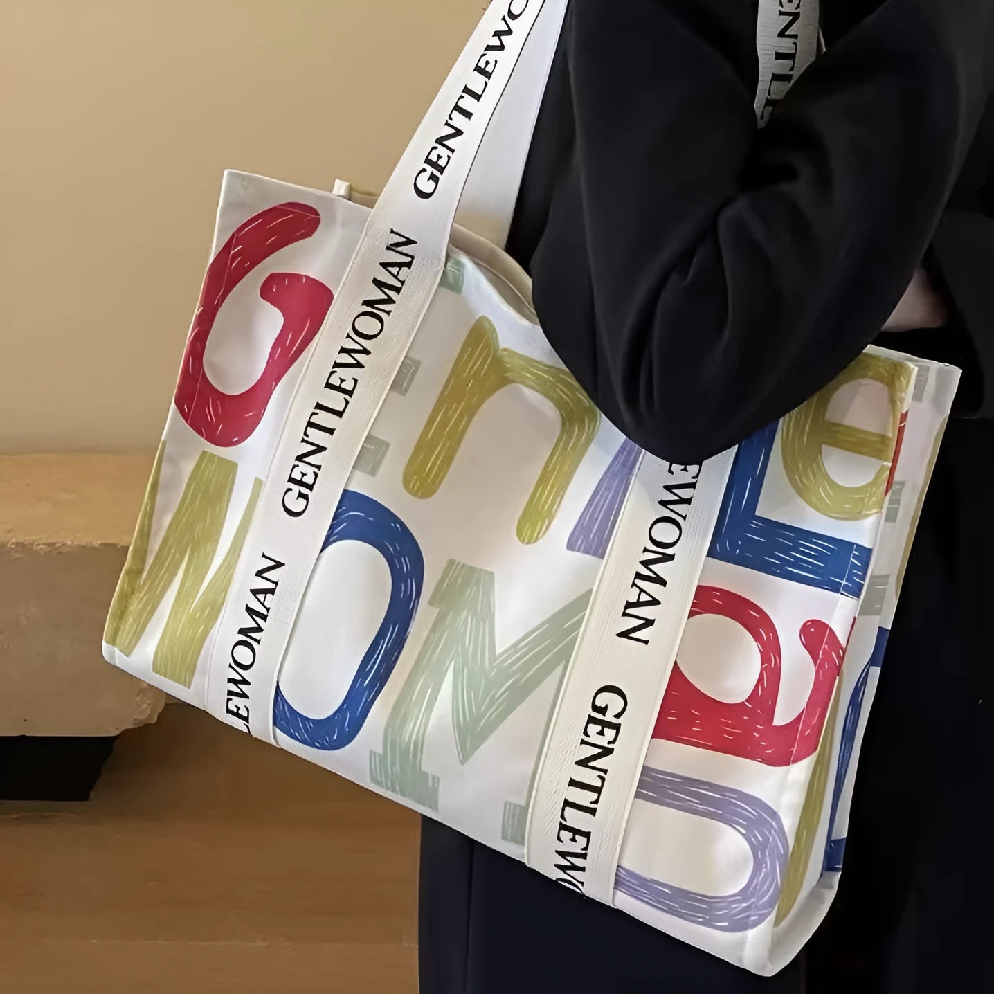 Large capacity canvas tote bag showing three design options: black letters, coloured letters, and pattern print