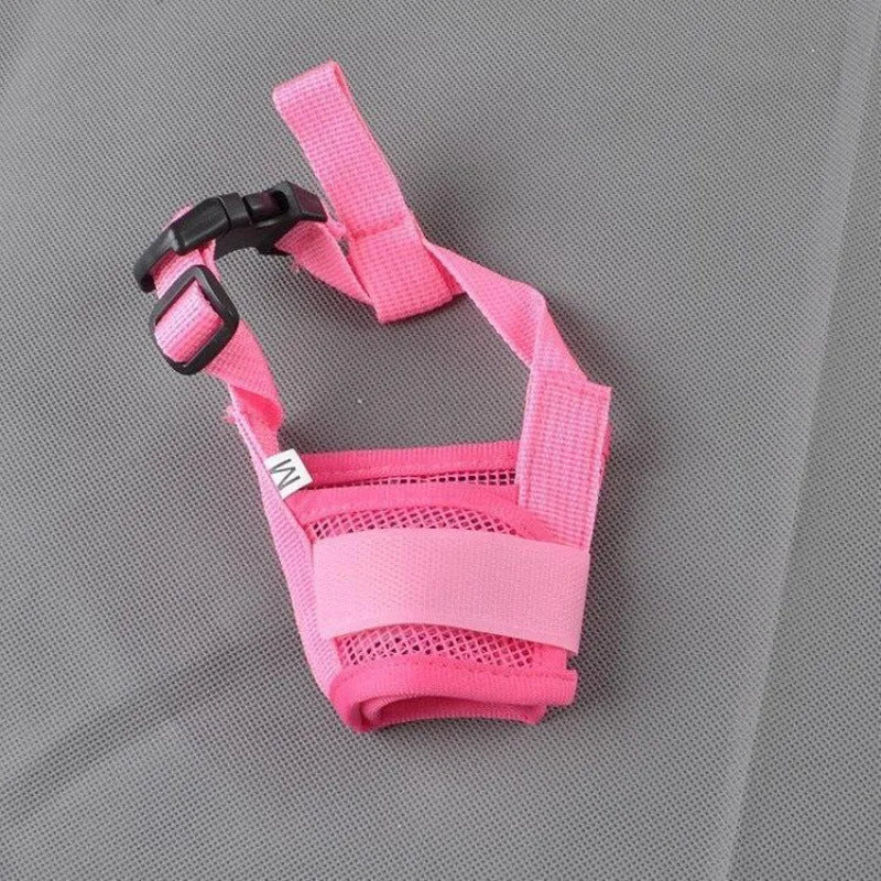 A black adjustable plastic mesh dog muzzle shown on a size chart with options for blue, pink, purple, and red.