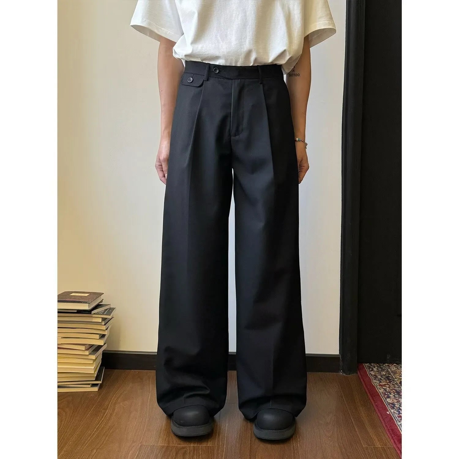 Man wearing brown straight-leg loose wide-leg casual suit pants made from polyester blend fabric