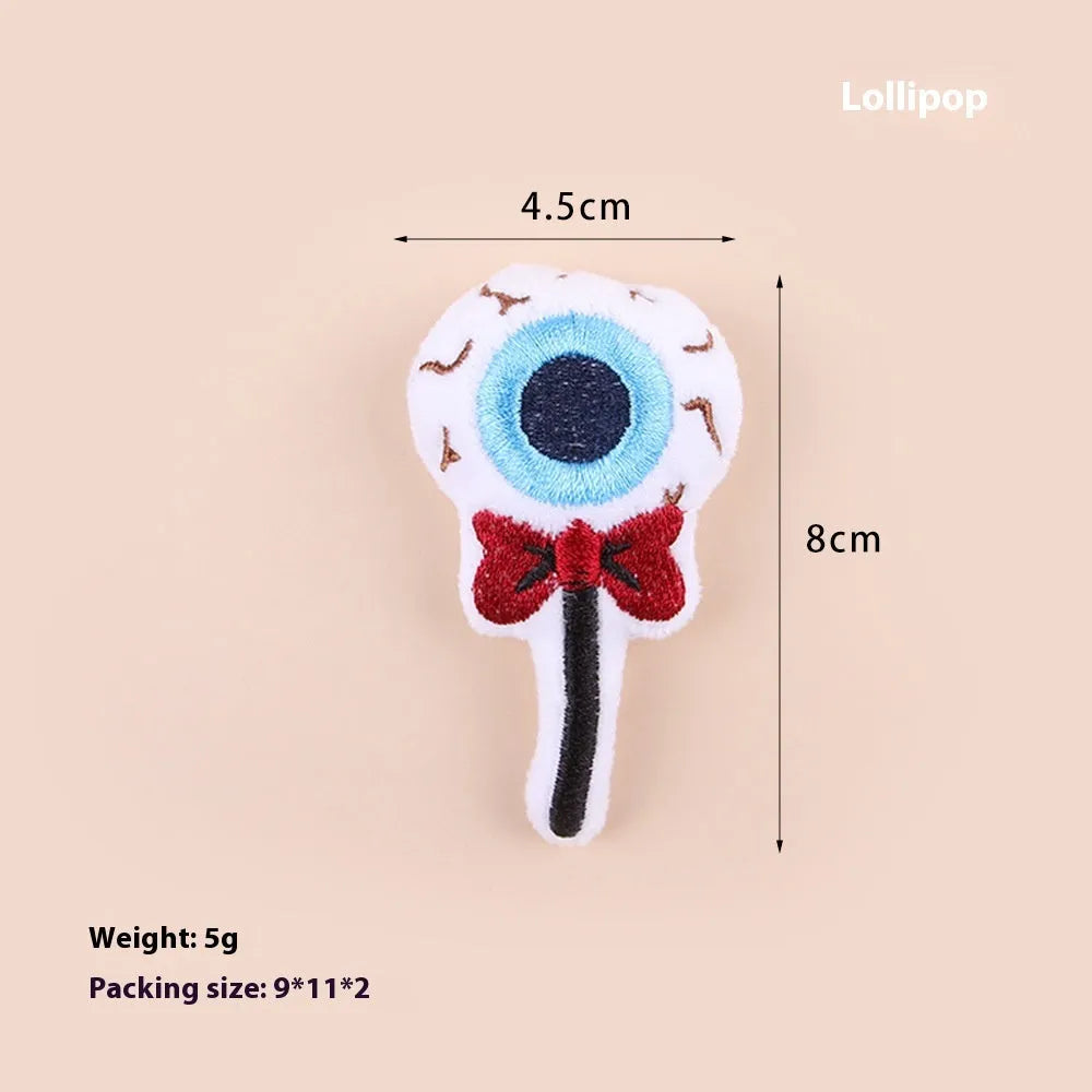 Small plush cat teaser toy with flexible handle in candy, eyes, or skull design