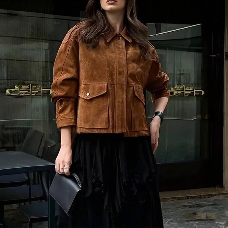 Women's bright brown suede coat with regular sleeves on a hanger