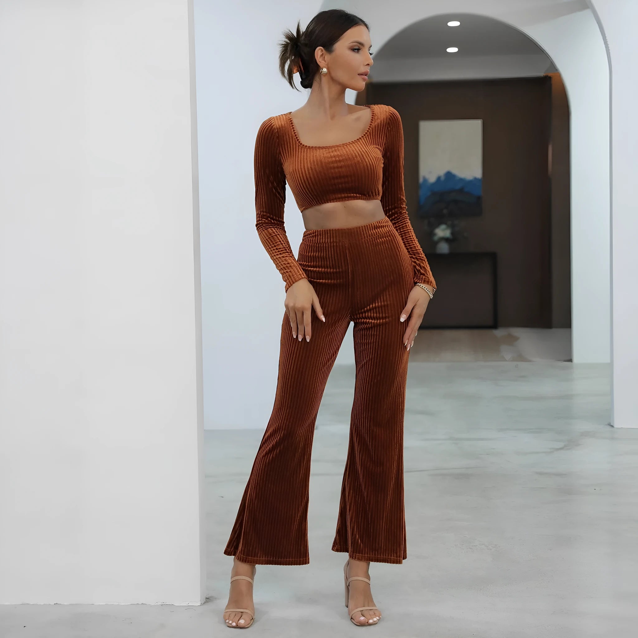 Caramel coloured long sleeve sweater set with matching trousers on hanger