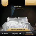 Silk quilt cover four-piece bedding set in solid colour with matching sheets