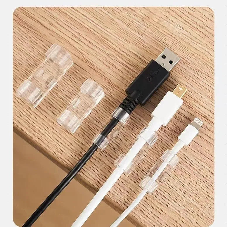 Transparent plastic self-adhesive cable clips in four size variants for wire organisation