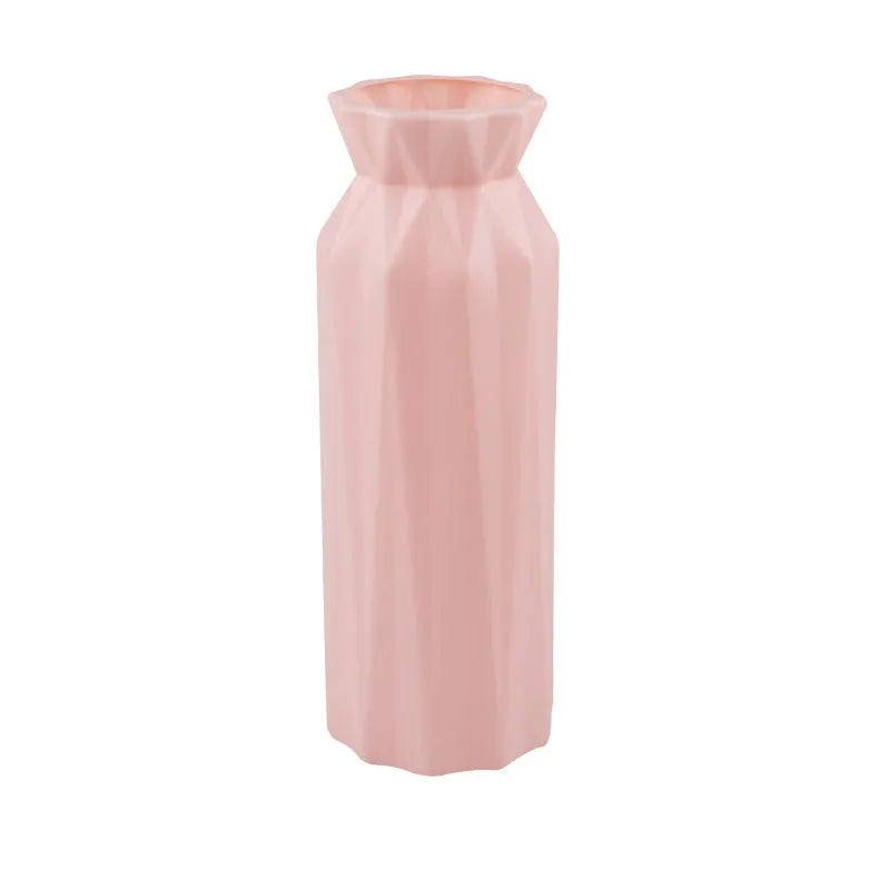 Green melamine plastic vase with a wide 7.2cm base on a wooden table.
