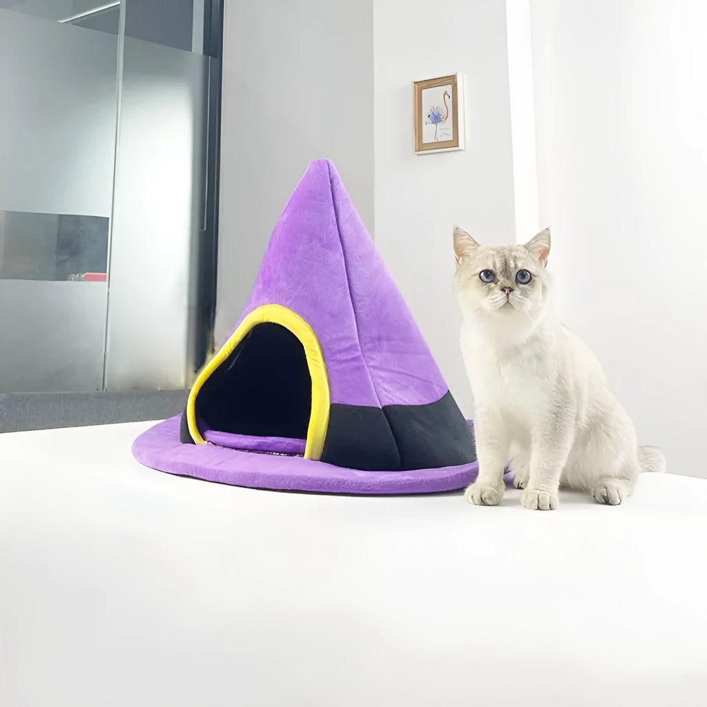 Purple witch hat shaped cat bed measuring 60 by 45 centimetres