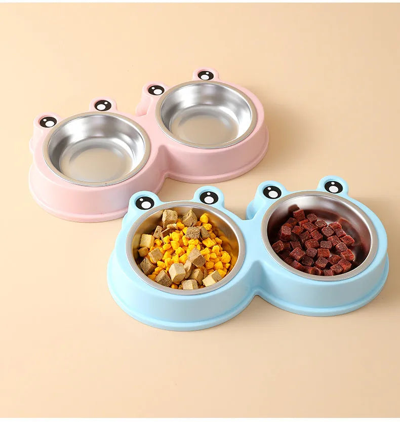 Blue stainless steel double bowl pet feeder with frog-shaped centrepiece for cat or dog food and water.