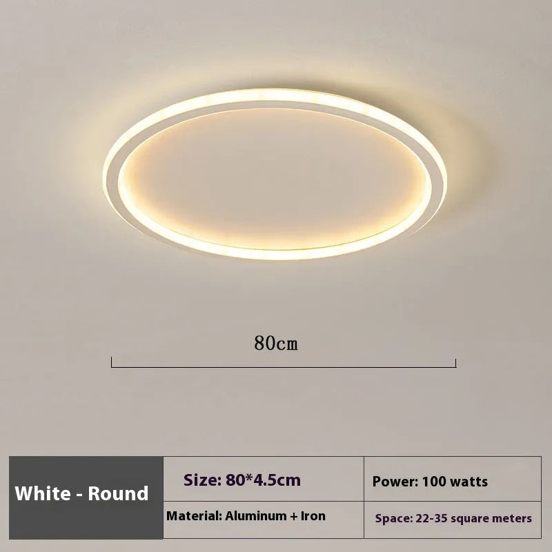 Minimalist flat disc LED ceiling light in black, white or gold finish.