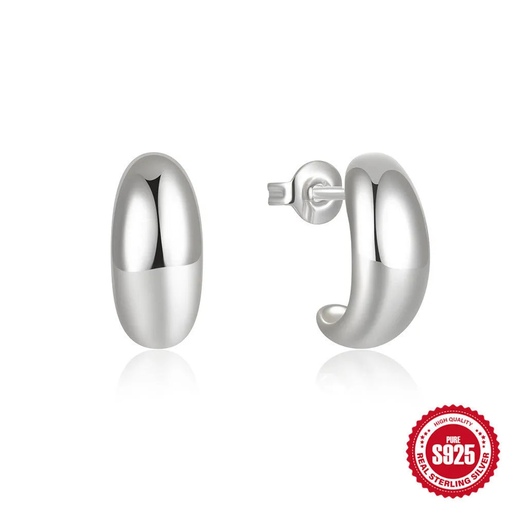 C-shaped sterling silver stud earrings with gold electroplated finish
